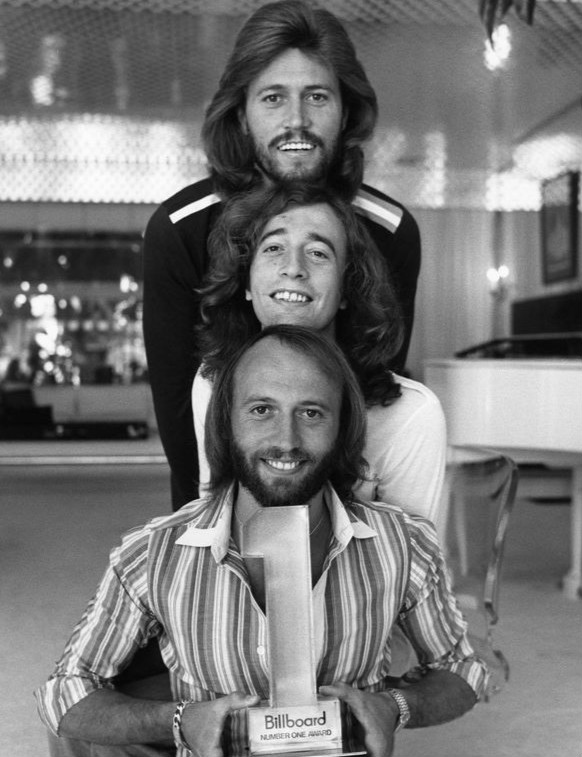 (top to bottom) Barry, Robin, and Maurice Gibb