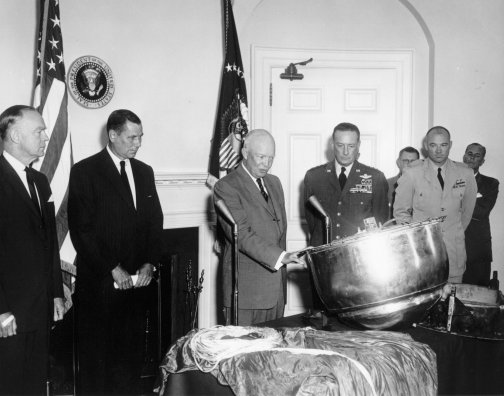 Eisenhower inspects the recovered capsule