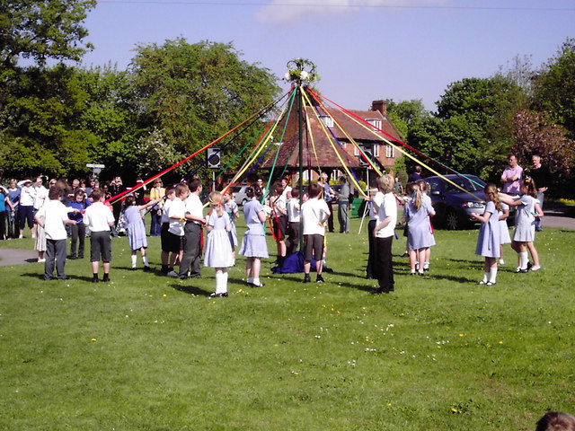 Children dancing around a maypole