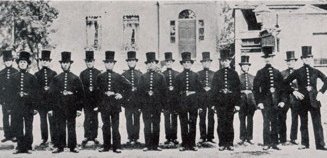 Early Bobbies in uniform, which included top hats