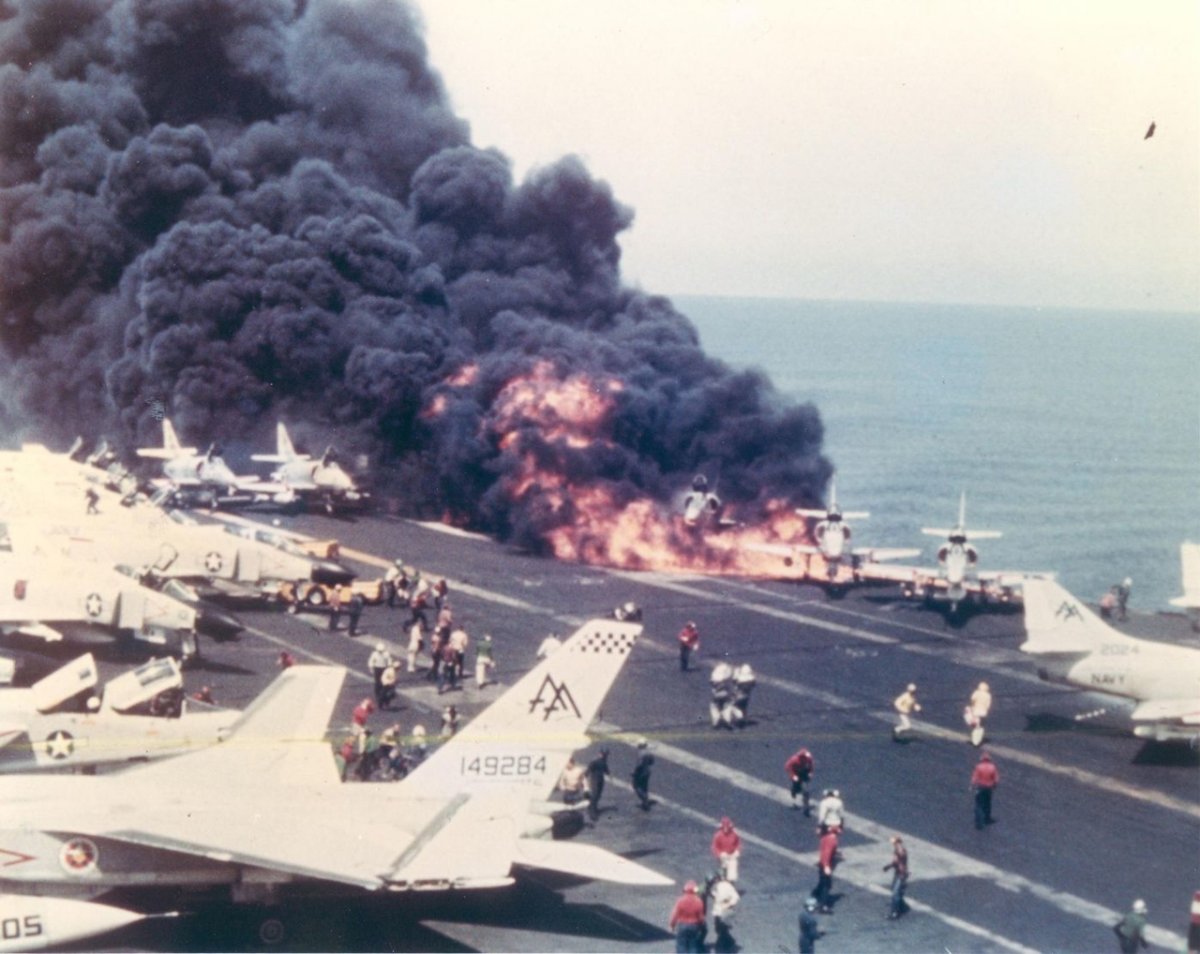 An A-4 Skyhawk burns after its fuel tank was struck by a Zuni missile