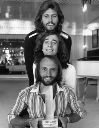 (top to bottom) Barry, Robin, and Maurice Gibb