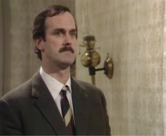 John Cleese as Basil Fawlty