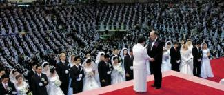 Moon presiding over a mass wedding